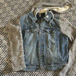 Free people adorable Jean jacket with sweatshirt sleeves.